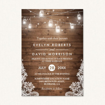 Barn themed wedding invitations with string lights, lace and wood.
