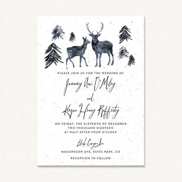 Deer wedding invites with winter deer and pine trees.