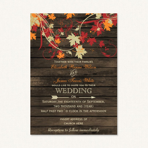 Fall rustic wedding invitations with autumn color leaf flourishes on a barn wood background