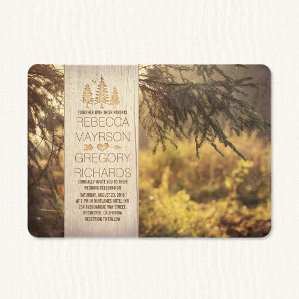 Rustic themed wedding invitations with country imagery, pine trees and woodgrain.