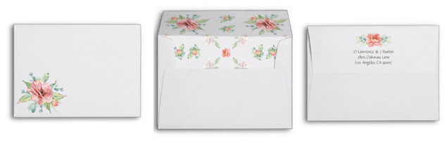 Watercolor flower wedding invitations matching floral envelopes with return address.