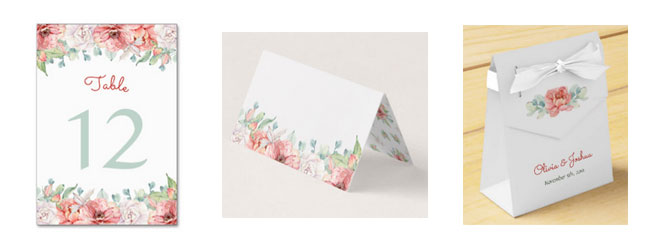 Matching watercolor flower wedding stationery and items.